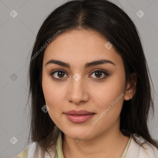 Joyful latino young-adult female with medium  brown hair and brown eyes