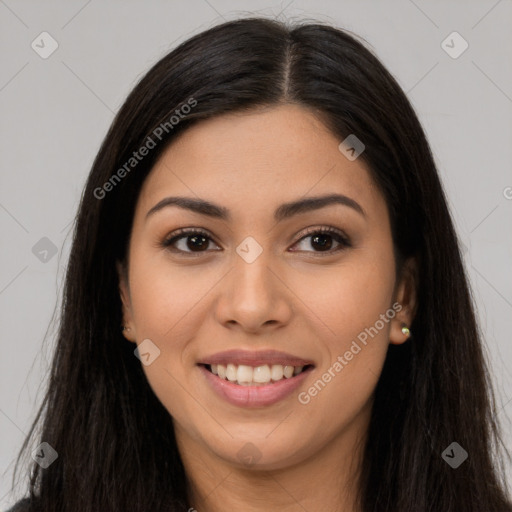 Joyful latino young-adult female with long  brown hair and brown eyes