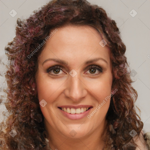 Joyful white adult female with long  brown hair and brown eyes