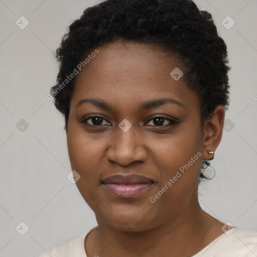 Joyful black young-adult female with short  brown hair and brown eyes