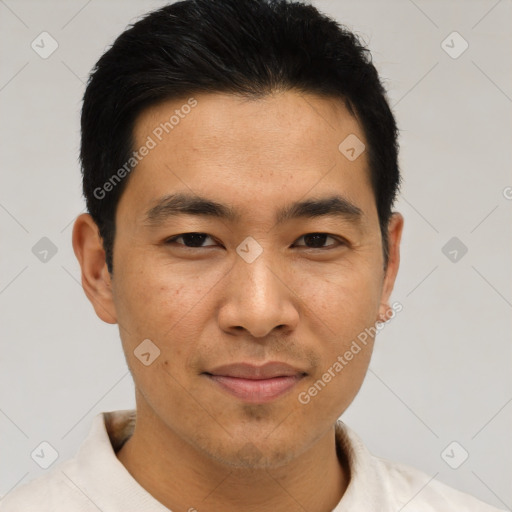 Joyful asian young-adult male with short  black hair and brown eyes