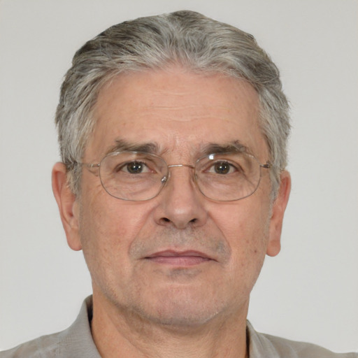 Neutral white middle-aged male with short  gray hair and brown eyes