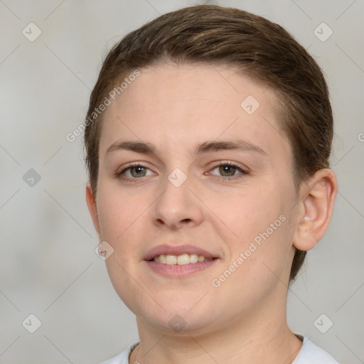 Joyful white young-adult female with short  brown hair and grey eyes