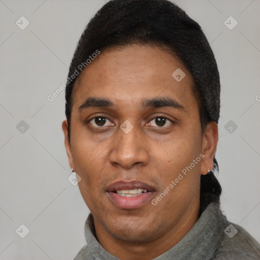 Joyful black adult male with short  black hair and brown eyes