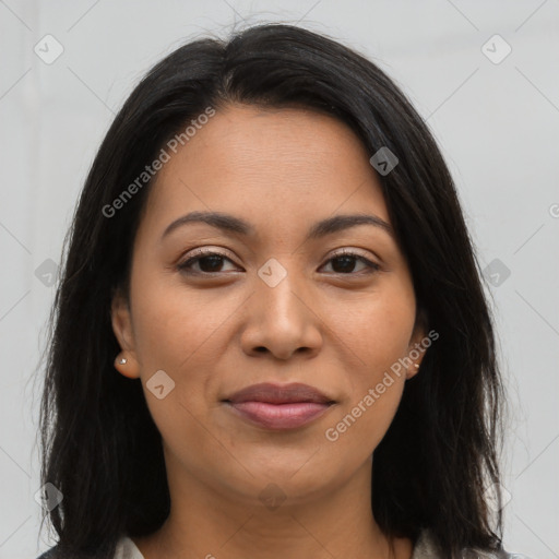 Joyful latino young-adult female with long  brown hair and brown eyes