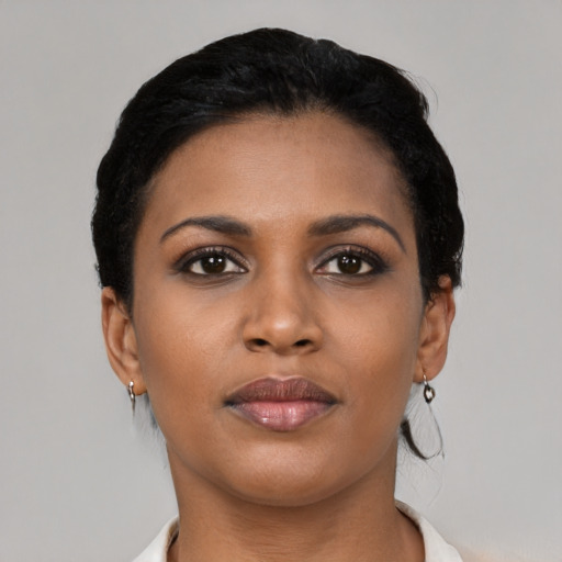 Neutral black young-adult female with short  black hair and brown eyes