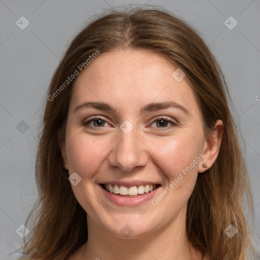 Joyful white young-adult female with long  brown hair and grey eyes