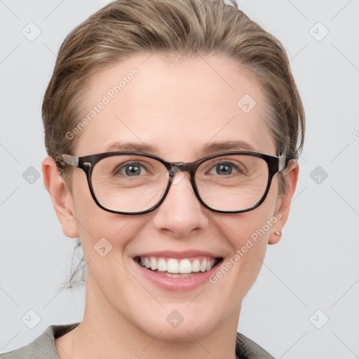 Joyful white young-adult female with medium  brown hair and blue eyes