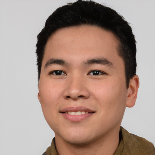 Joyful asian young-adult male with short  brown hair and brown eyes