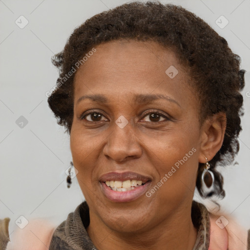 Joyful latino adult female with medium  brown hair and brown eyes