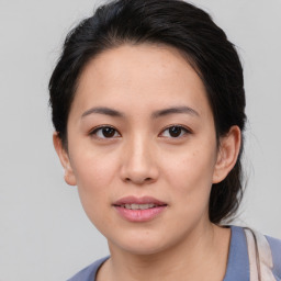 Joyful asian young-adult female with medium  brown hair and brown eyes