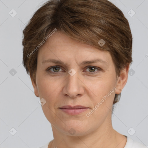 Joyful white adult female with short  brown hair and grey eyes