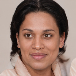 Joyful white adult female with medium  brown hair and brown eyes