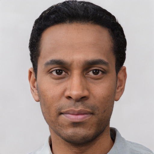 Neutral latino young-adult male with short  black hair and brown eyes