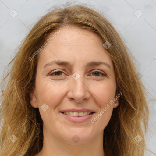 Joyful white adult female with long  brown hair and brown eyes