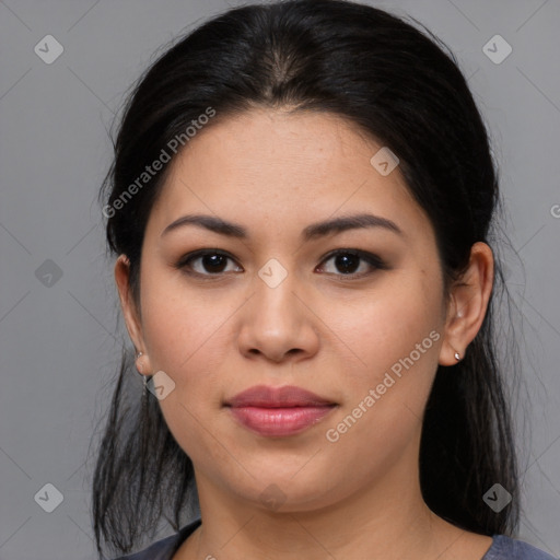 Joyful latino young-adult female with medium  brown hair and brown eyes