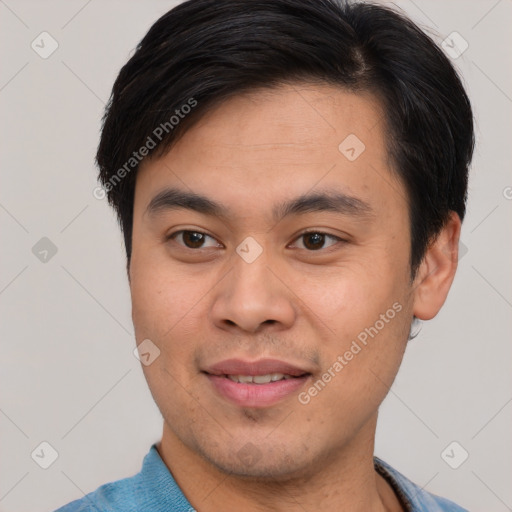 Joyful asian young-adult male with short  brown hair and brown eyes