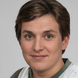 Joyful white adult female with short  brown hair and grey eyes