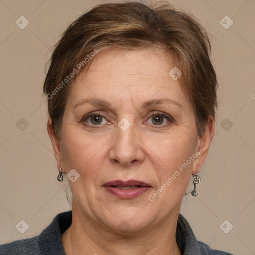 Joyful white adult female with short  brown hair and grey eyes