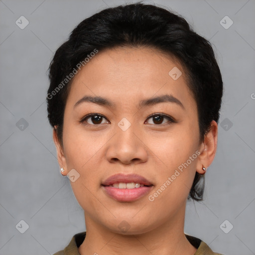 Joyful asian young-adult female with short  black hair and brown eyes