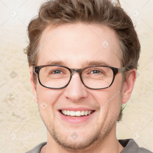 Joyful white adult male with short  brown hair and grey eyes