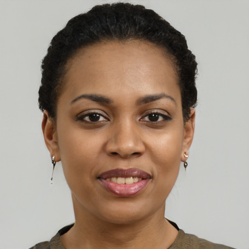 Joyful latino young-adult female with short  black hair and brown eyes