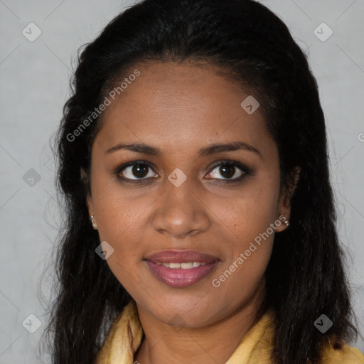 Joyful black young-adult female with long  brown hair and brown eyes