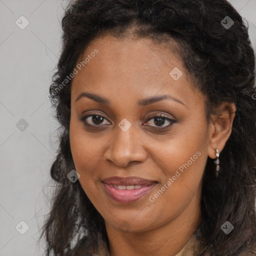 Joyful black young-adult female with long  brown hair and brown eyes