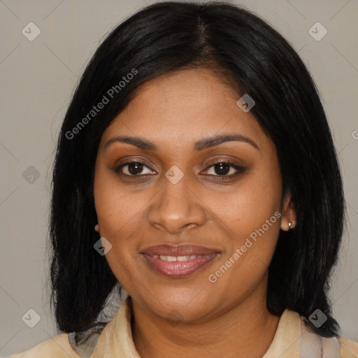 Joyful black adult female with medium  black hair and brown eyes