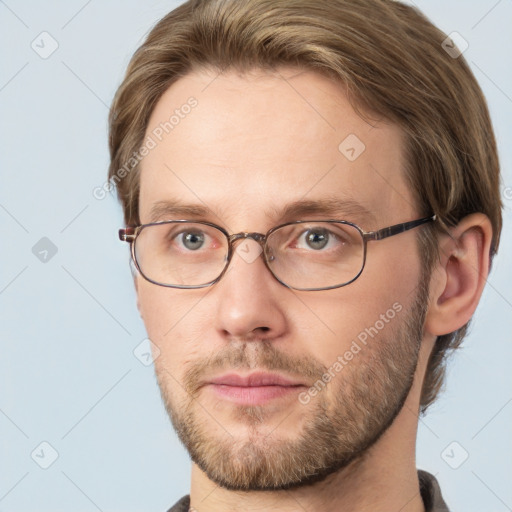 Joyful white adult male with short  brown hair and grey eyes