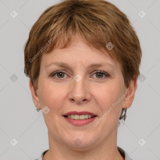 Joyful white adult female with short  brown hair and grey eyes