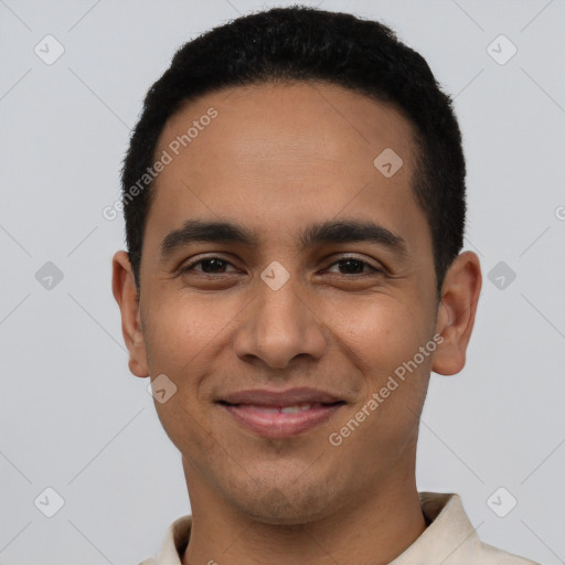 Joyful latino young-adult male with short  black hair and brown eyes