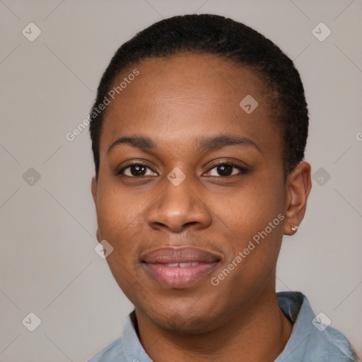 Joyful black young-adult female with short  black hair and brown eyes