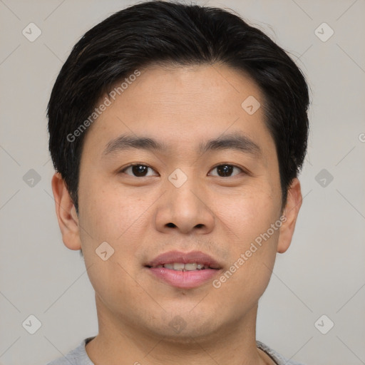 Joyful asian young-adult male with short  brown hair and brown eyes