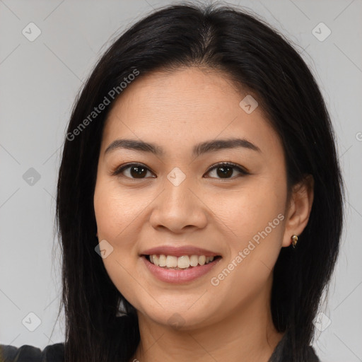 Joyful asian young-adult female with long  brown hair and brown eyes