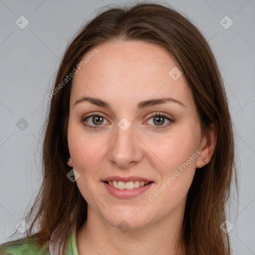 Joyful white young-adult female with long  brown hair and green eyes