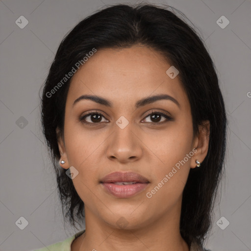 Joyful latino young-adult female with medium  brown hair and brown eyes