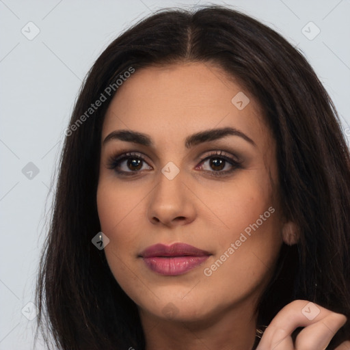 Joyful latino young-adult female with long  brown hair and brown eyes