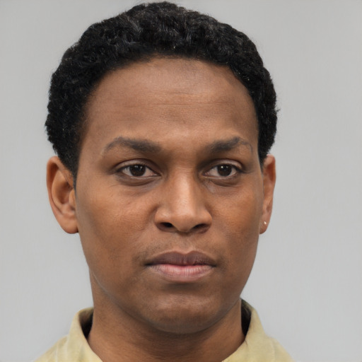 Neutral black young-adult male with short  black hair and brown eyes