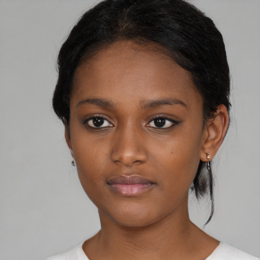 Neutral black young-adult female with medium  black hair and brown eyes
