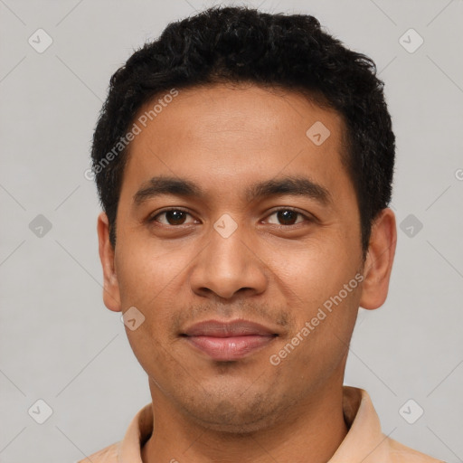 Joyful latino young-adult male with short  black hair and brown eyes