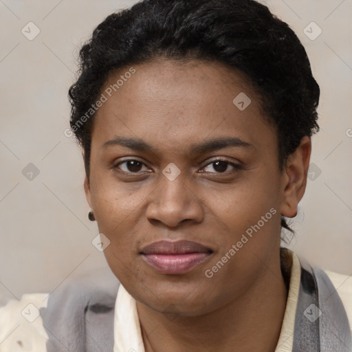 Joyful black young-adult female with short  black hair and brown eyes