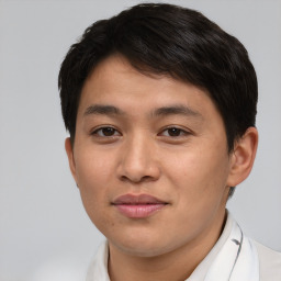 Joyful asian young-adult male with short  brown hair and brown eyes