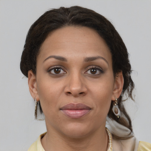 Joyful white adult female with short  brown hair and brown eyes