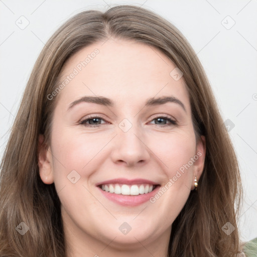 Joyful white young-adult female with long  brown hair and grey eyes