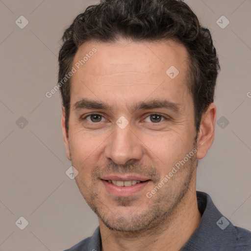 Joyful white adult male with short  black hair and brown eyes