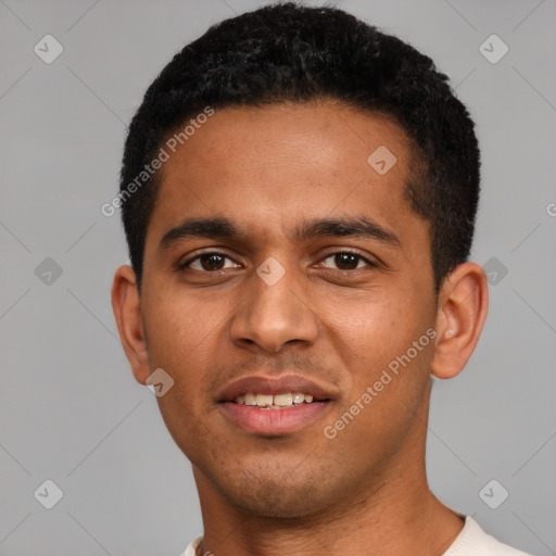 Joyful black young-adult male with short  brown hair and brown eyes