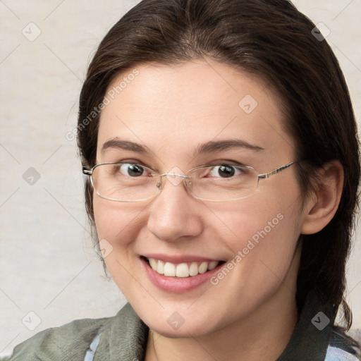 Joyful white young-adult female with medium  brown hair and brown eyes