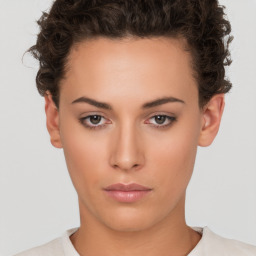 Neutral white young-adult female with short  brown hair and brown eyes