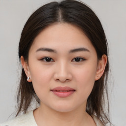 Joyful asian young-adult female with medium  brown hair and brown eyes